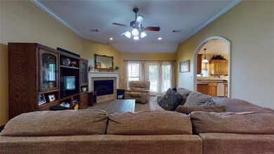 Another view of Den with Ceiling Fan