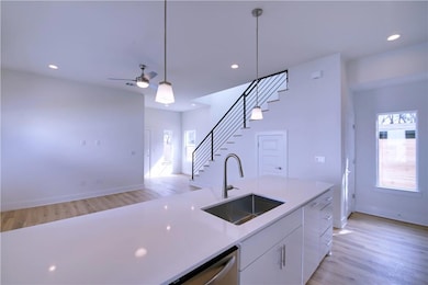 Kitchen with a healthy amount of sunlight, a sink