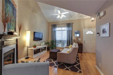 View of the living room from the dining room area...house lives much larger than the SF.