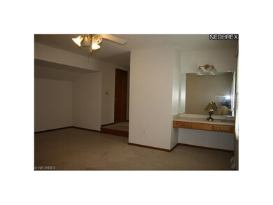 master bedroom with built in vanity area.