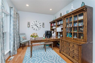 Versatile & spacious office/den office with hardwood flooring