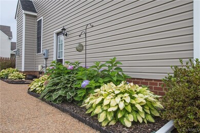 Lush hostas and hydrangeas along the side of the h