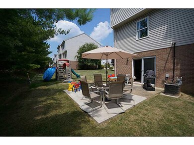 Exterior Back. The yard spills out to the side yar