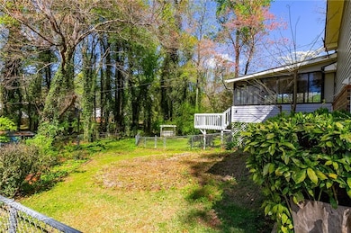 View of backyard and the enclosed sunroom