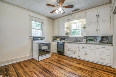 THE KITCHEN AREA SITS ON THE BACK OF THE HOME ACCE