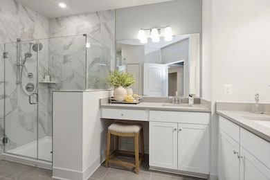 Primary bath with split vanities and shower