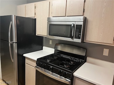 Kitchen with appliances with stainless steel finis