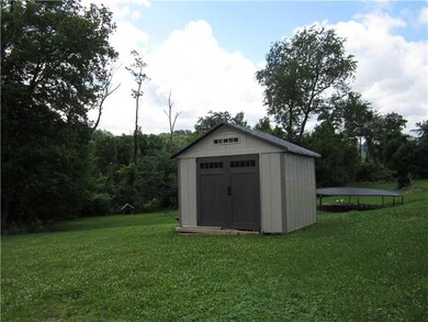 Exterior Back. Shed is included with sale.