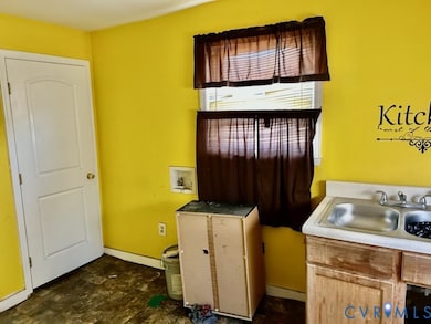 Laundry room featuring hookup for a washing machine and baseboards