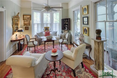 Parlor windows open completely to porch.