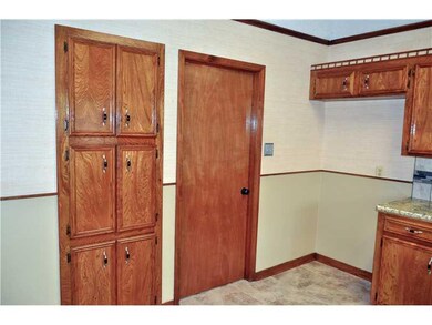 Kitchen View 2. All Wood trim, door, cabinet has b