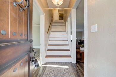 Stairs with dark wood-type flooring and ornamental