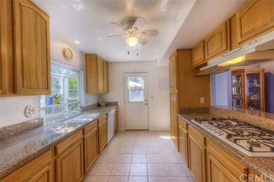 Light and bright kitchen with garden window over t