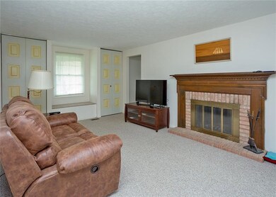 The family room offers storage and a gas log burni