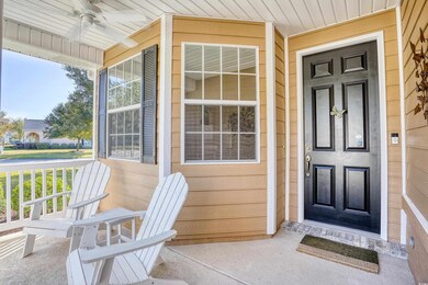 The covered front porch overlooks the front and si