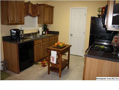 Wonderful kitchen with black appliances, good counter and cabinet space, and pantry.