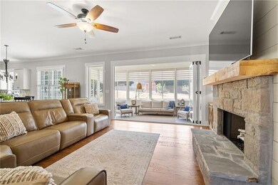Everyday Elegance - With its thoughtful layout and bright sunroom views, this living space feels as functional as it is beautiful.