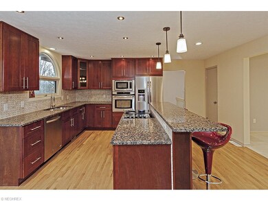 The kitchen showcases beautiful cabinets, stainles