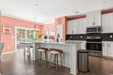 Kitchen with visible vents, a sink, a chandelier, 