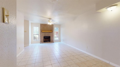 Unfurnished living room with a brick fireplace, li