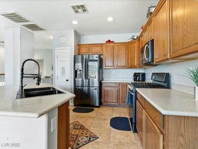 Kitchen featuring stainless steel appliances, a si