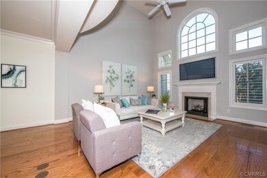 Great Room has gas fireplace and lots of windows.