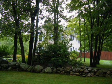 Exterior Front. Private front yard with natural st