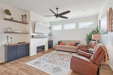 Living area with light wood finished floors, visib