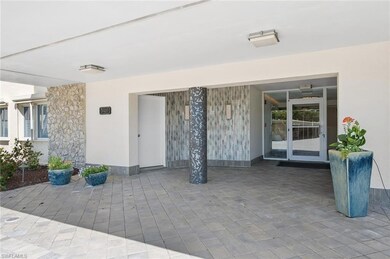View of exterior entry with a patio and stucco siding