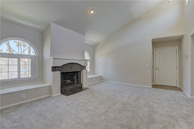 Unfurnished living room with carpet flooring, high