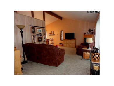 Vaulted living room which is open to the dining ro