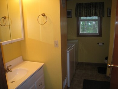 Bathroom with first floor laundry area