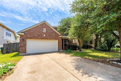 View of front of home with brick siding, concrete