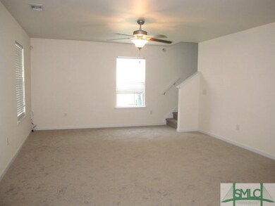 Living room with new flooring and fresh paint.
