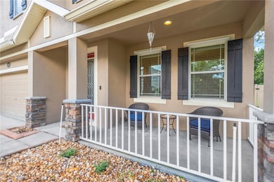 Pretty front porch, fresh, easy care landscaping.