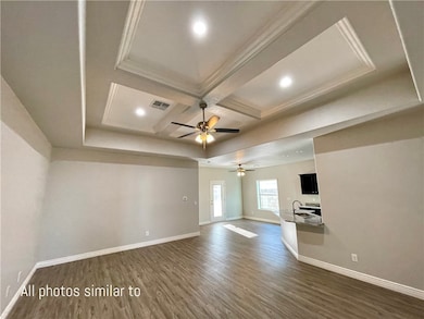 Empty room featuring dark wood finished floors, co