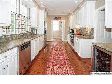 Kitchen with stainless appliances and adjoining la