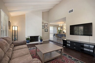 Volume ceiilings in the living room that is warmed by the fireplace