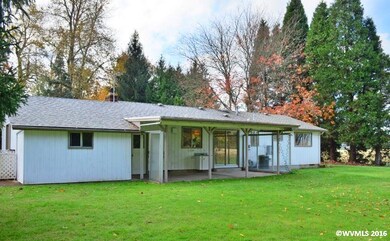 Covered patio and tool shed off garage.