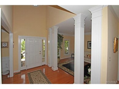 Impressive foyer with a soaring ceiling and open t