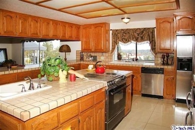 The kitchen is wonderfully large and had three ove