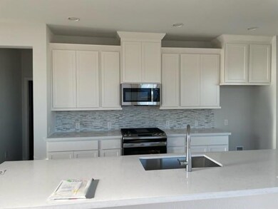 Kitchen featuring stainless steel appliances, a s