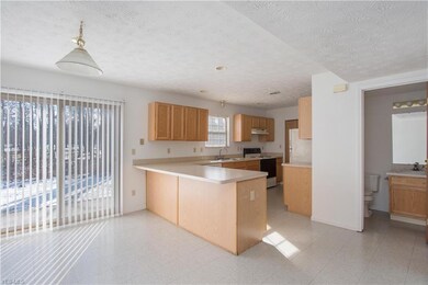 SPACIOUS DINING AREA OVERLOOKING THE KITCHEN WITH RECESS LIGHTING!