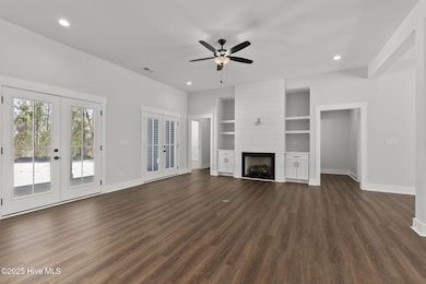 Living Room w/ Fireplace & Built-Ins