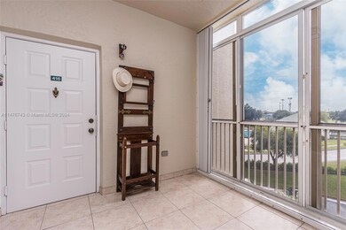 Front entryway fully screened with accordion hurricane shutters