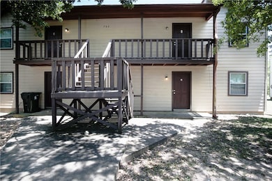Rear view of property featuring a balcony