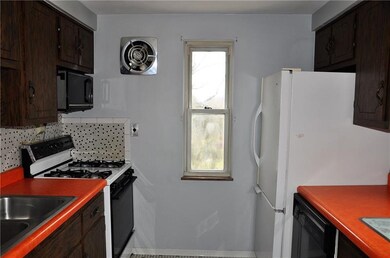 Galley kitchen with gas stove. Room size 10x8.