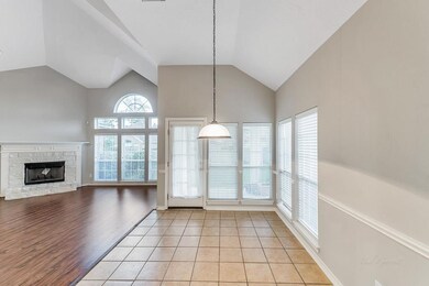 BREAKFAST AREA - is located adjacent to the kitchen and features chair rail and access to the covered back patio. This eating space measures 13x9.
