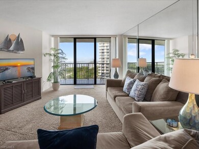 Carpeted living room with a wall of windows
