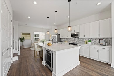 Townhome - Open concept living/dining/kitchen. Virtually Staged.